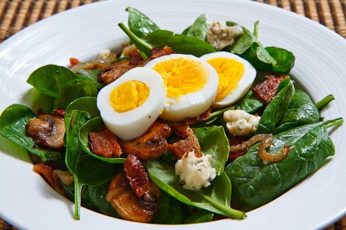 Spinach Salad with Bacon, Caramelized Onions, Mushrooms and Blue Cheese in a Bacon Pan Sauce Dressing Topped with a Hard Boiled Egg Spinach Salad with Bacon, Caramelized Onions, Mushrooms and Blue Cheese in a Bacon Pan Sauce Dressing Topped with a Hard Boiled Egg