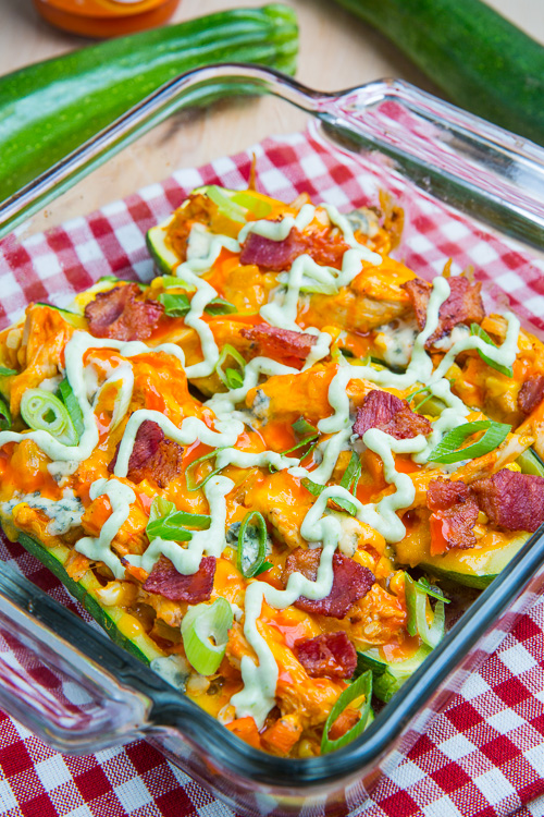 Buffalo Chicken Stuffed Zucchini topped with Melted Cheddar, Bacon and an Avocado Blue Cheese Dressing Buffalo Chicken Stuffed Zucchini topped with Melted Cheddar, Bacon and an Avocado Blue Cheese Dressing