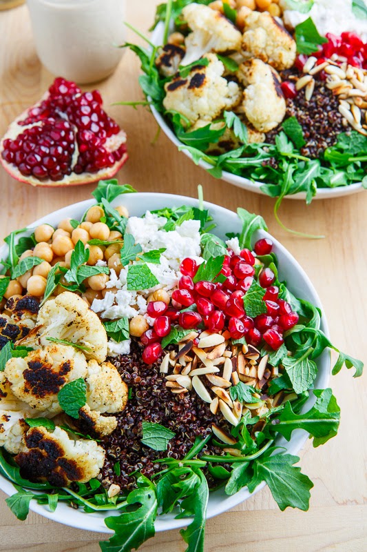 Roasted Cauliflower and Chickpea Quinoa and Arugula Salad with Almonds, Pomegranate and Feta in a Lemony Tahini Dressing Roasted Cauliflower and Chickpea Quinoa and Arugula Salad with Almonds, Pomegranate and Feta in a Lemony Tahini Dressing