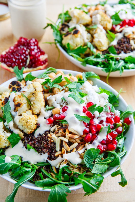 Roasted Cauliflower and Chickpea Quinoa and Arugula Salad with Almonds, Pomegranate and Feta in a Lemony Tahini Dressing Roasted Cauliflower and Chickpea Quinoa and Arugula Salad with Almonds, Pomegranate and Feta in a Lemony Tahini Dressing