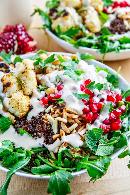 Roasted Cauliflower and Chickpea Quinoa and Arugula Salad with Almonds, Pomegranate and Feta in a Lemony Tahini Dressing Roasted Cauliflower and Chickpea Quinoa and Arugula Salad with Almonds, Pomegranate and Feta in a Lemony Tahini Dressing