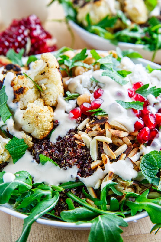 Roasted Cauliflower and Chickpea Quinoa and Arugula Salad with Almonds, Pomegranate and Feta in a Lemony Tahini Dressing Roasted Cauliflower and Chickpea Quinoa and Arugula Salad with Almonds, Pomegranate and Feta in a Lemony Tahini Dressing