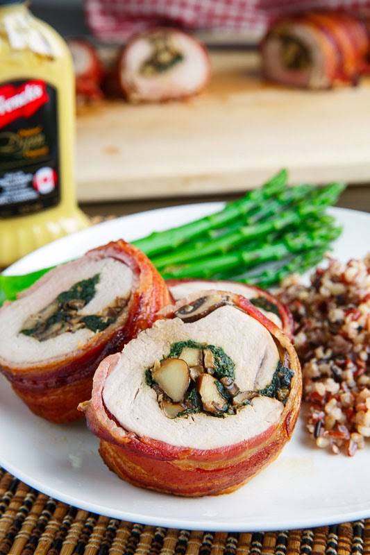 Bacon Wrapped, Mushroom and Spinach Stuffed Pork Tenderloin in a Creamy Dijon Goat Cheese Sauce Bacon Wrapped, Mushroom and Spinach Stuffed Pork Tenderloin in a Creamy Dijon Goat Cheese Sauce