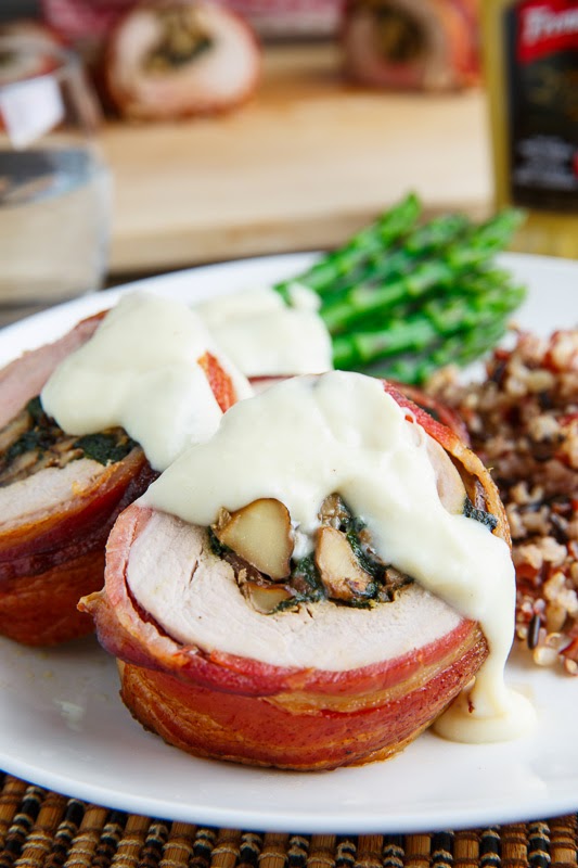 Bacon Wrapped, Mushroom and Spinach Stuffed Pork Tenderloin in a Creamy Dijon Goat Cheese Sauce Bacon Wrapped, Mushroom and Spinach Stuffed Pork Tenderloin in a Creamy Dijon Goat Cheese Sauce