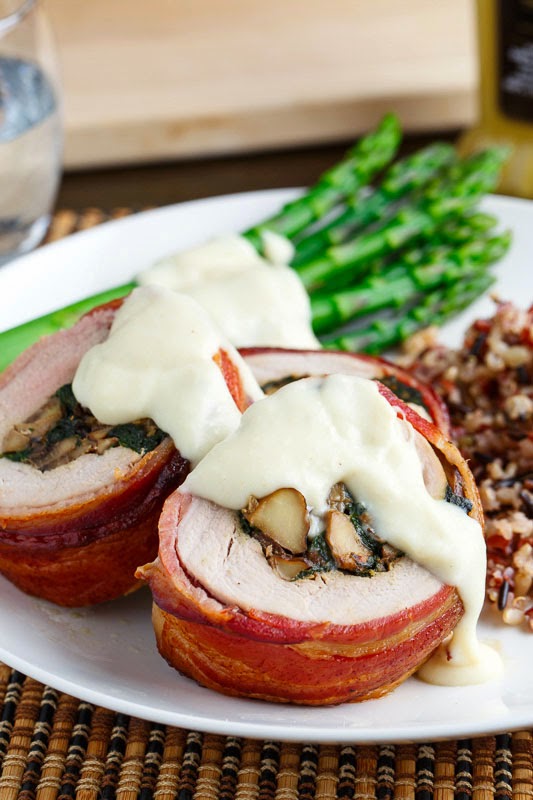 Bacon Wrapped, Mushroom and Spinach Stuffed Pork Tenderloin in a Creamy Dijon Goat Cheese Sauce Bacon Wrapped, Mushroom and Spinach Stuffed Pork Tenderloin in a Creamy Dijon Goat Cheese Sauce