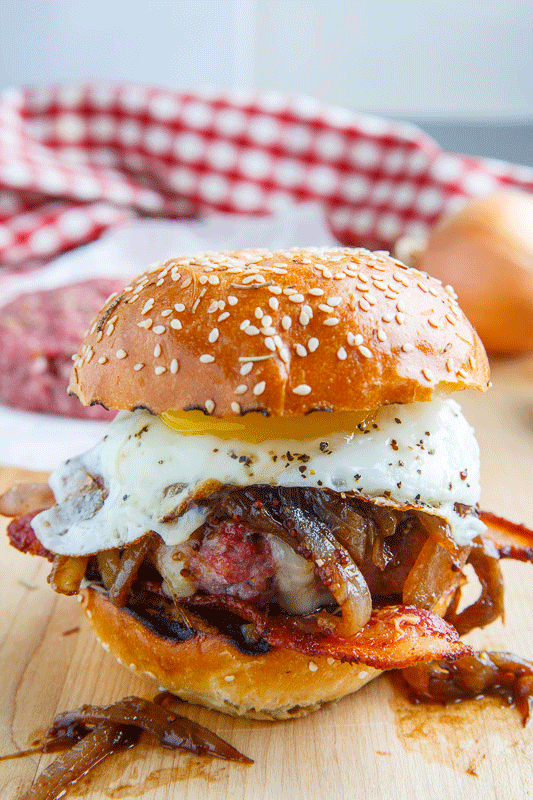 Bacon and Cheese Corned Beef Burger with Guinness Caramelized Onions and a Fried Egg Bacon and Cheese Corned Beef Burger with Guinness Caramelized Onions and a Fried Egg