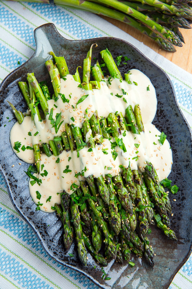 Grilled Asparagus in Lemon Maple Tahini with Tomatoes and Cucumbers Grilled Asparagus in Lemon Maple Tahini with Tomatoes and Cucumbers