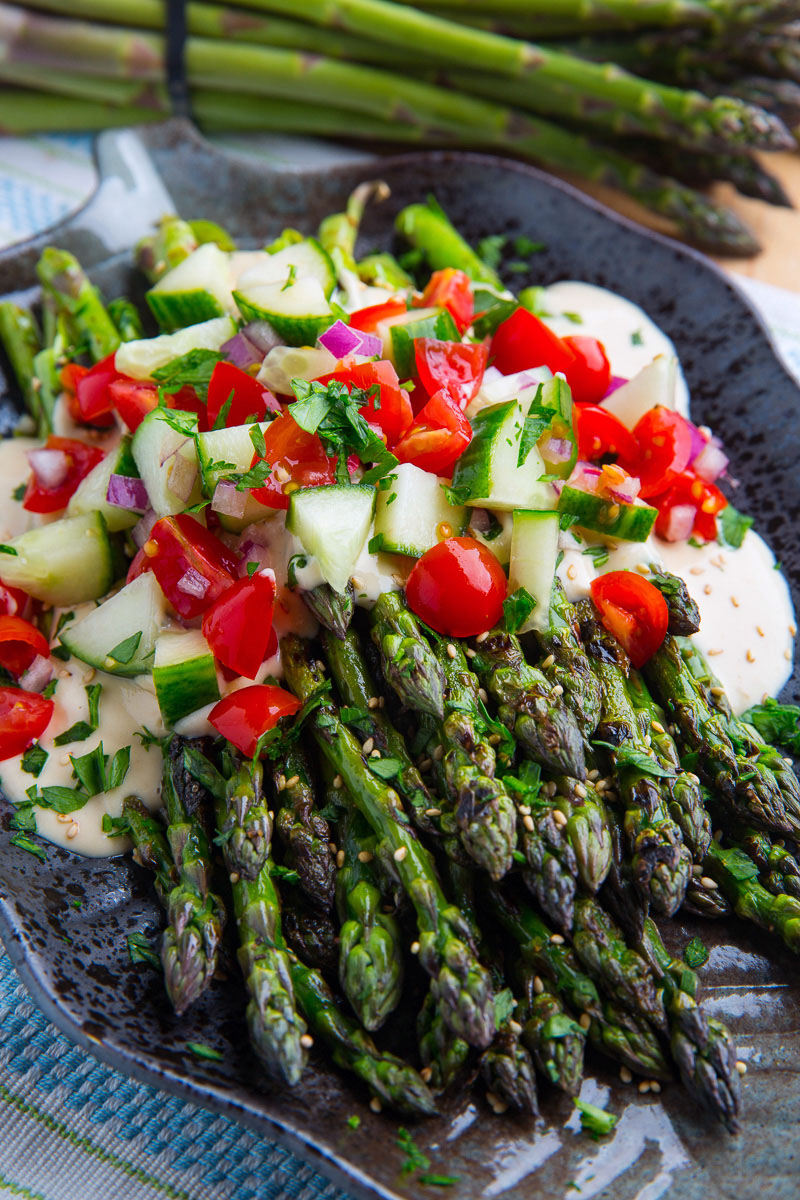 Grilled Asparagus in Lemon Maple Tahini with Tomatoes and Cucumbers Grilled Asparagus in Lemon Maple Tahini with Tomatoes and Cucumbers